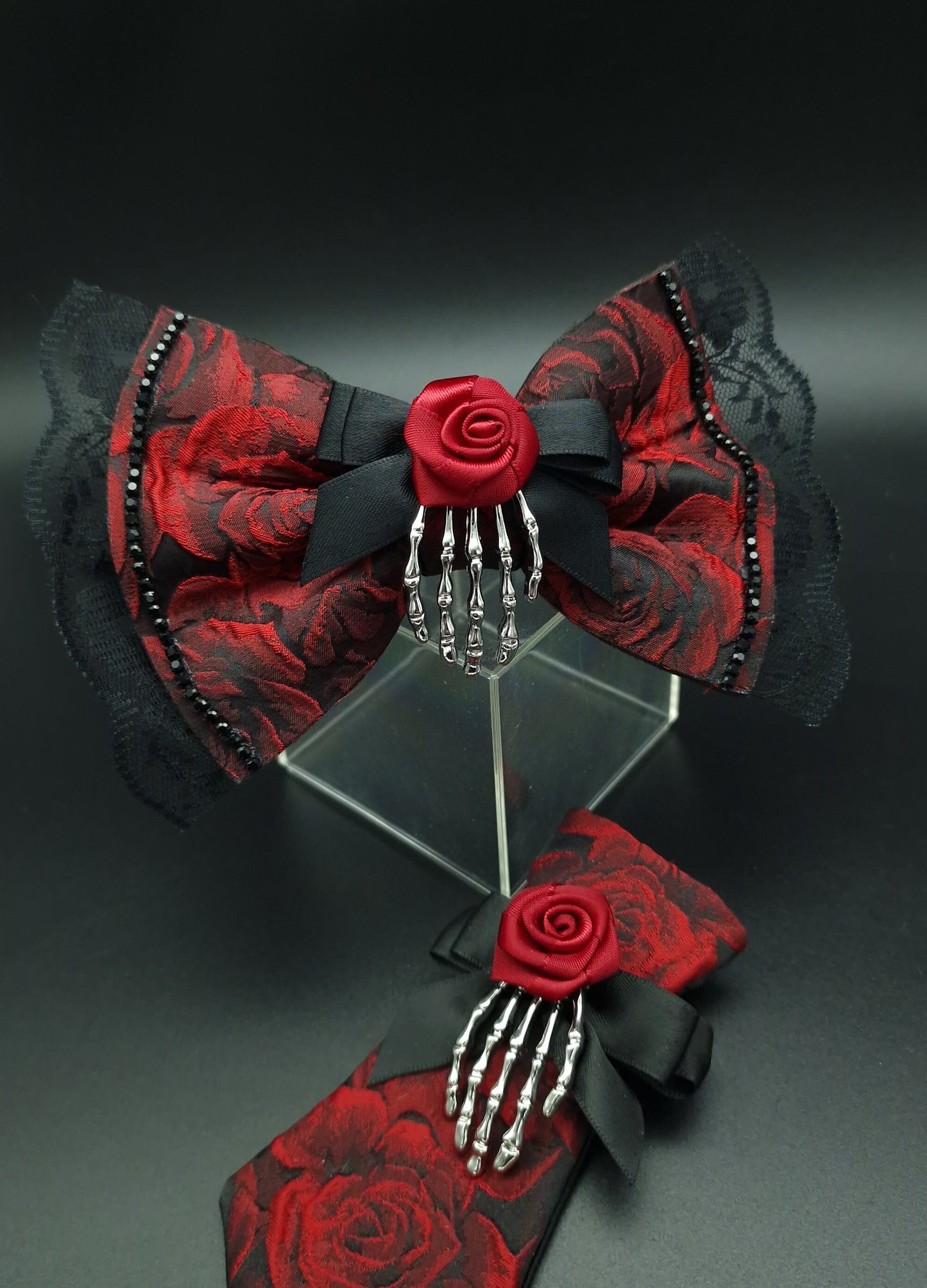 Red rose bow with removable skeleton hand broach